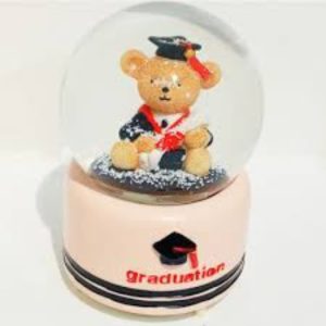 cream snow globe with graduation bear inside